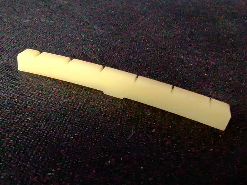 HOSCO Unbleached Slotted 9.5" Radius Bone Nut (with tab)
